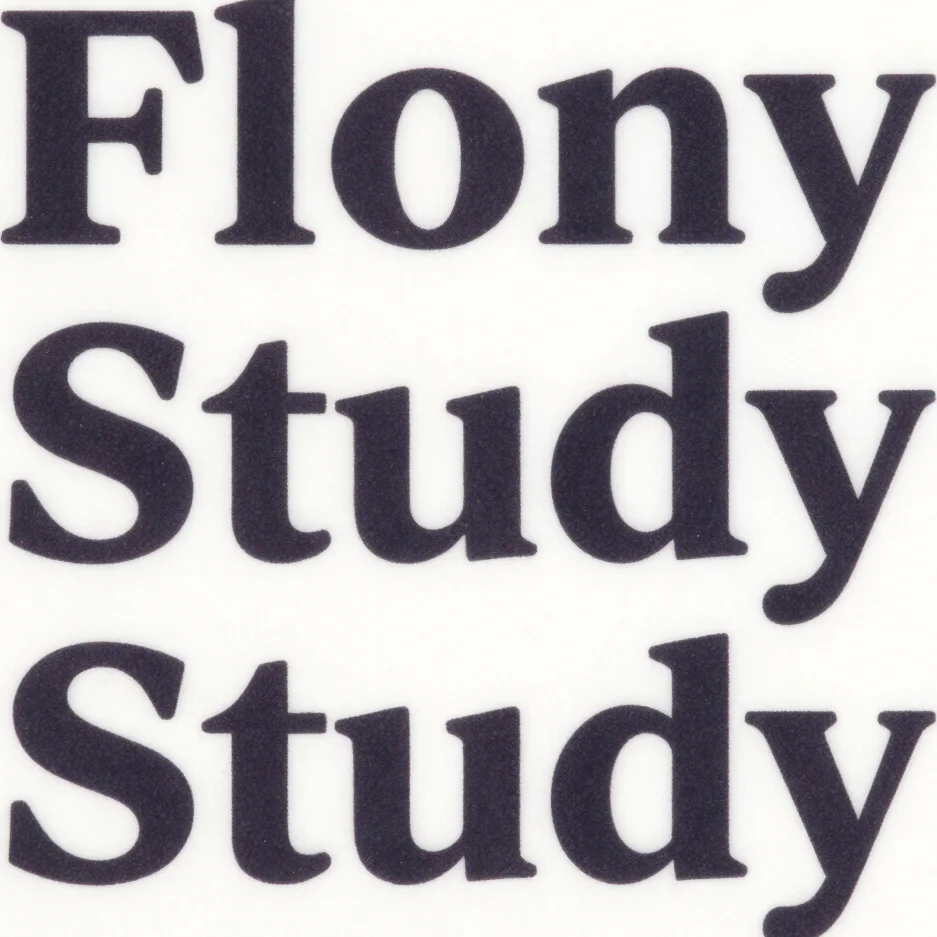 Close-up of minimal printed collateral study with deep charcoal typography, 35mm lens